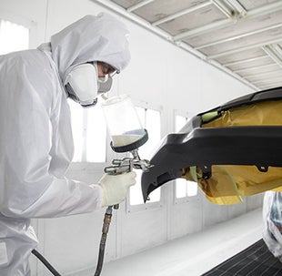Collision Center Technician Painting a Vehicle | Jim Shorkey Toyota in Pittsburgh PA